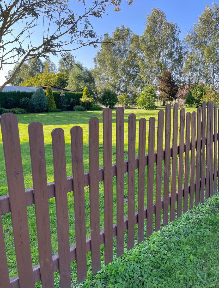 Wood fence painted in PaintEco Linseed Oil Paint Deer shade.