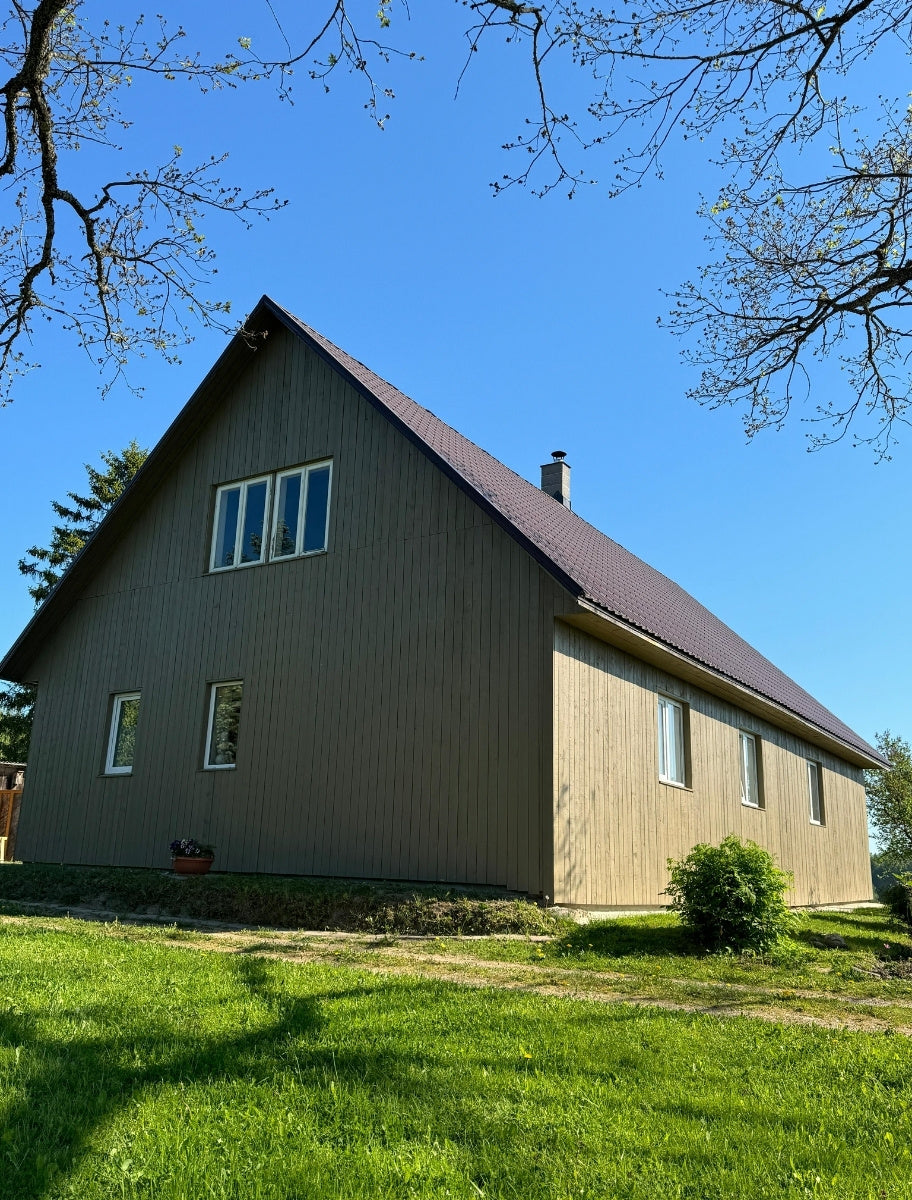 Exterior of a wooden house painted with Paint Eco Natural Paint In Olive shade.