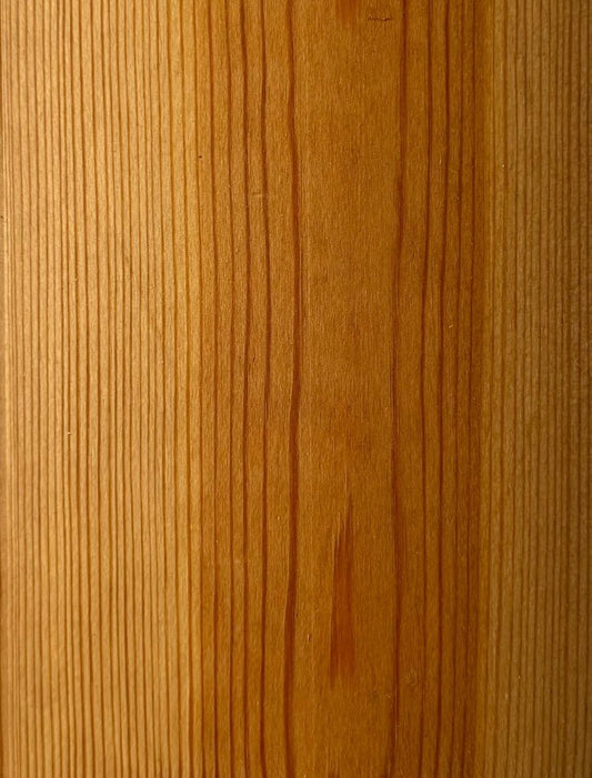 Close-up of wooden surface treated with PAINT ECO Tar Oil, highlighting rich color and smooth finish.