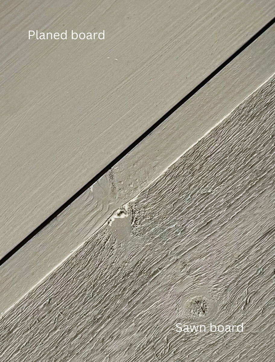 Close-up of a wooden board painted with Paint Eco natural paint, showing a smooth and textured wood finish.