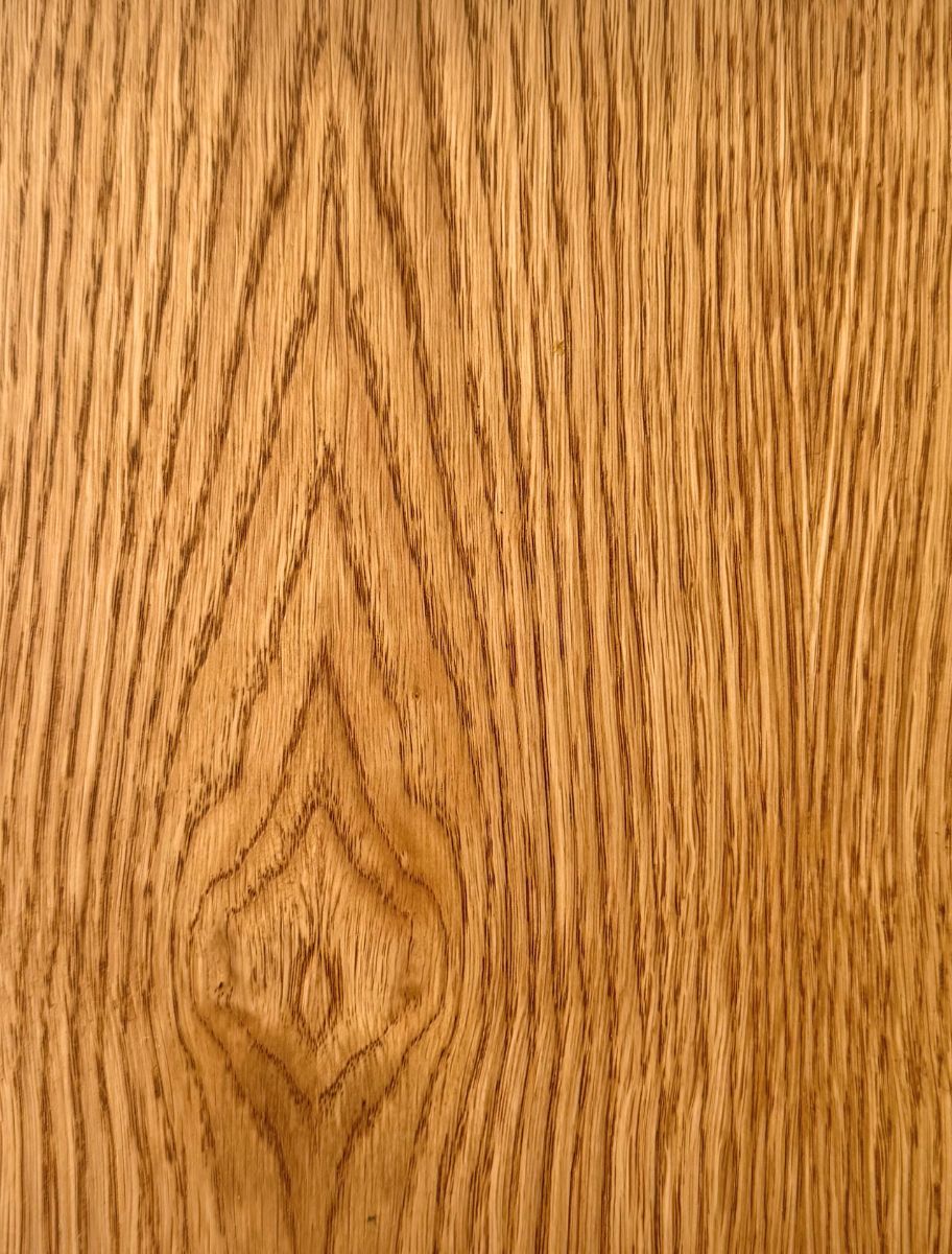 Close-up of wooden surface finished with Paint Eco Tinted Hard Wax Oil Honey shade