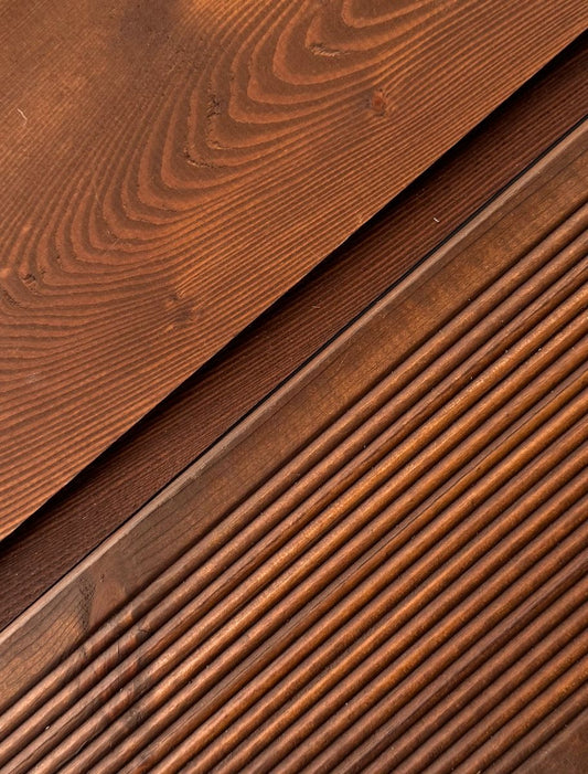 Comparison of untreated vs. treated wooden terrace boards, demonstrating the effectiveness of PAINT ECO's stain in enriching wood appearance.