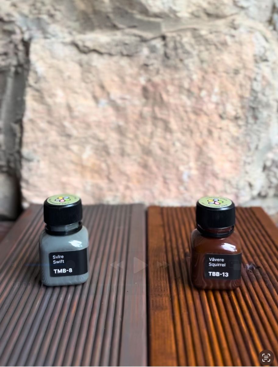 Application of PAINT ECO's linseed oil-based stain on outdoor decking, highlighting the product's deep penetration and protective finish.